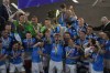 FILE - Napoli's players celebrate after winning the Serie A soccer title trophy at the Diego Maradona Stadium, in Naples, Sunday, June 4, 2023. After ending a 33-year wait for the title, Napoli will be looking to retain its crown. However, it has lost one of its key players in South Korean defender Kim Min-jae, while coach Luciano Spalletti has also left the club. (AP Photo/Andrew Medichini, File)