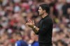 Arsenal's manager Mikel Arteta claps his hands during the English Premier League soccer match between Arsenal and Nottingham Forest at Emirates stadium in London, Saturday, Aug. 12, 2023. (AP Photo/Kirsty Wigglesworth)
