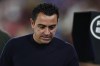 FILE - Barcelona's head coach Xavi Hernandez walks before the Spanish La Liga soccer match against Getafe at the Coliseum Alfonso Perez stadium in Getafe, Spain, Sunday, Aug. 13, 2023. Barcelona will be missing coach Xavi Hernandez and winger Raphinha for its first competitive game at its temporary home stadium. Barcelona hosts Cadiz at the Lluis Companys Olympic Stadium on Sunday, Aug. 20. (AP Photo/Alvaro Medranda, file)
