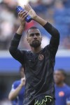 Chelsea's goalkeeper Robert Sanchez applauds fans at the end of the English Premier League soccer match between Chelsea and Liverpool at Stamford Bridge Stadium in London, Sunday, Aug. 13, 2023. (AP Photo/Ian Walton)