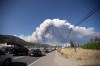 A fast-burning wildfire threatening West Kelowna, B.C., is challenging firefighting crews as they brace for what the operations director with BC Wildfire Service has predicted will be the most challenging days of the season so far. Smoke from the McDougall Creek wildfire is seen from Westbank, B.C., Thursday, Aug. 17, 2023. THE CANADIAN PRESS/Joe O'Connal