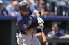 Seattle Mariners' Julio Rodriguez hits an RBI triple during the sixth inning of a baseball game against the Kansas City Royals Thursday, Aug. 17, 2023, in Kansas City, Mo. (AP Photo/Charlie Riedel)