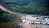 Vehicles line-up for fuel at Fort Providence, N.W.T., on the only road south from Yellowknife, Thursday, Aug. 17, 2023. THE CANADIAN PRESS/Jeff McIntosh