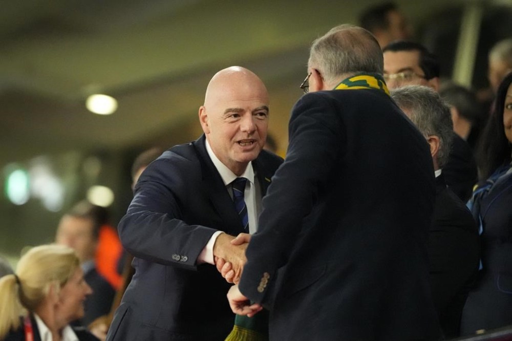 President of FIFA Gianni Infantino, left, shakes hands with Australian Prime Minister Anthony Albanese ahead of the Women's World Cup semifinal soccer match between Australia and England at Stadium Australia in Sydney, Australia, Wednesday, Aug. 16, 2023. (AP Photo/Mark Baker)
