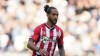 FILE - Southampton's Theo Walcott in action during an English Premier League soccer match against Leeds United at St. Mary's Stadium in Southampton, England, on Oct. 16, 2021. Walcott retired from professional soccer on Friday, Aug. 18, 2023 at age 34 after an 18-year career. Walcott scored 129 goals in 560 games for Southampton, Arsenal and Everton. He made 47 appearances for England. Walcott began and ended his career with Southampton. (AP Photo/Steve Luciano)
