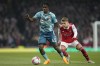 FILE - Southampton's Romeo Lavia, left, and Arsenal's Martin Odegaard vie for the ball during the English Premier League soccer match between Arsenal and Southampton at Emirates stadium in London, on April 21, 2023. Chelsea completed the signing of 19-year-old defensive midfielder Romeo Lavia from Southampton on Friday Aug. 18, 2023 after agreeing to a reported transfer fee of 58 million pounds ($74 million). (AP Photo/Kirsty Wigglesworth, File)