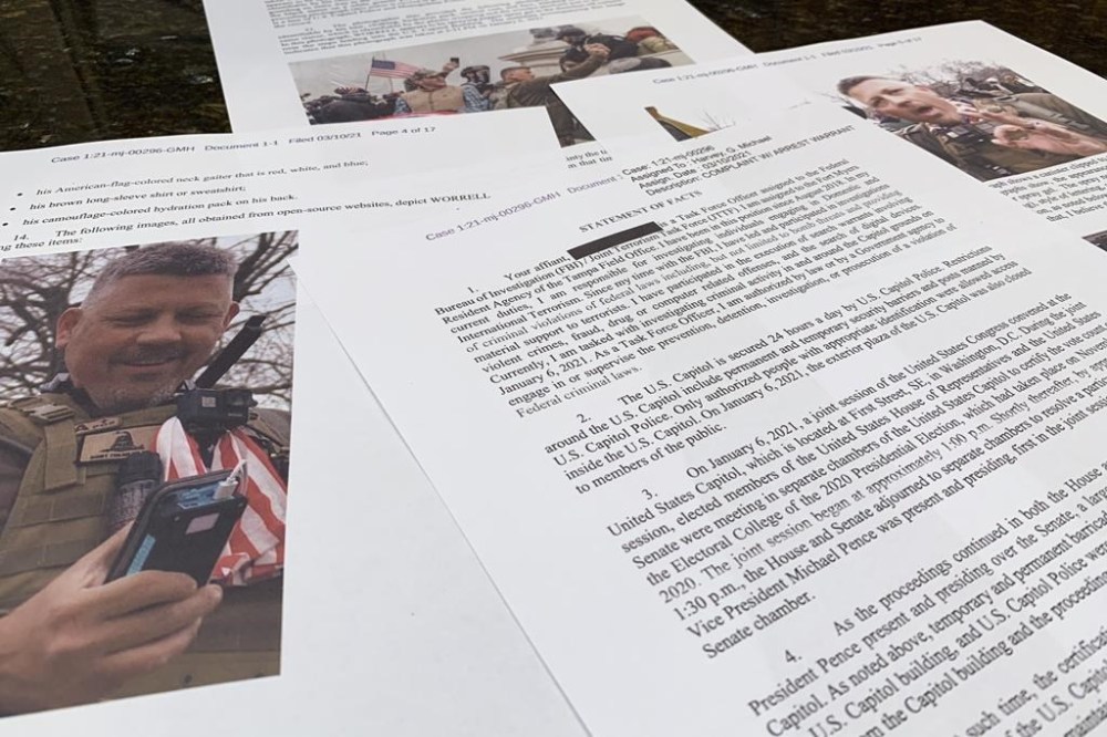 FILE - This photo shows part of the Justice Department's statement of facts in the complaint and arrest warrant for Christopher Worrell. Authorities are searching for Christopher Worrell, a member of the Proud Boys extremist group who disappeared days before his sentencing in a U.S. Capitol riot case, where prosecutors are seeking more than a decade in prison, according to a warrant made public Friday, Aug. 18, 2023. (AP Photo/Jon Elswick, File)
