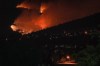 A state of emergency has been declared in Kelowna, a city with a population of about 150,000, as threatening wildfires prompt officials to issue evacuation orders in parts of British Columbia's Okanagan. The McDougall Creek wildfire burns on the mountainside above houses in West Kelowna, B.C., on Friday, Aug. 18, 2023. THE CANADIAN PRESS/Darryl Dyck