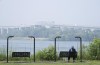 Smoke from fires in western and northern parts of Canada has created a hazardous air quality in Ontario's north. A woman looks out at the St. Lawrence River in LaSalle, Que., Friday, June 30, 2023. THE CANADIAN PRESS/Christinne Muschi