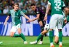 Bremen's Jens Stage, left and Bayern's Jamal Musiala fight for the ball, during the German Bundesliga soccer match between Werder Bremen and Bayern Munich, at the Weserstadion in Bremen, Germany, Friday, Aug. 18, 2023. (Carmen Jaspersen/dpa via AP)