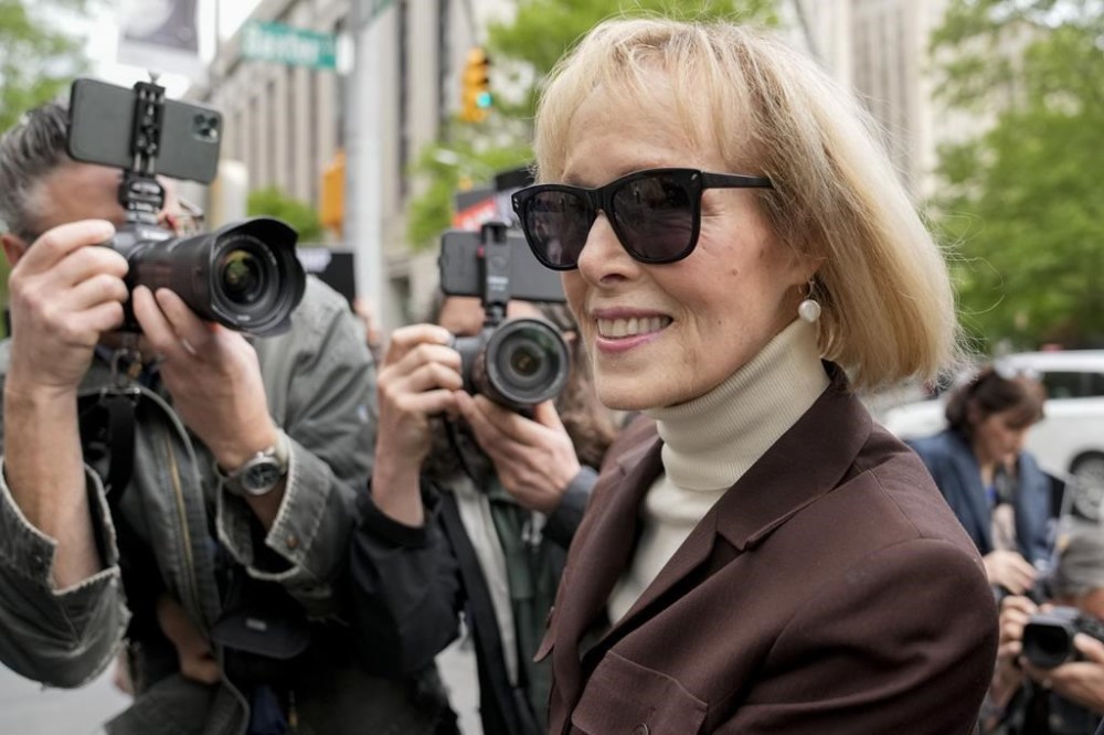 FILE - E. Jean Carroll arrives at Manhattan federal court, Tuesday, May 9, 2023, in New York. A New York federal judge expressed growing impatience Friday, Aug. 18, with what he calls ex-President Donald Trump’s “repeated efforts to delay” a defamation lawsuit against him, saying he won’t stop a January trial to await the outcome of a “frivolous” appeal of one of his rulings. In May, a jury awarded the writer, E. Jean Carroll, $5 million in damages, concluding she was sexually abused and defamed by Trump, though she was not raped. Her lawyers now seek another $10 million in compensatory damages and “substantially more” in punitive damages for remarks he made while president and after the jury verdict. (AP Photo/John Minchillo, File)