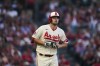 Los Angeles Angels' Nolan Schanuel takes off his gloves after drawing a walk from the Tampa Bay Rays during the second inning of a baseball game Friday, Aug. 18, 2023, in Anaheim, Calif. (AP Photo/Ryan Sun)