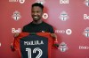 Newly signed Toronto F.C. forward Cassius Mailula, of South Africa, shows off his jersey at the team's training facility in Toronto, Friday, Aug. 18, 2023. For Toronto, the 22-year-old represents both an investment in the future and a possible payday down the line. THE CANADIAN PRESS/Neil Davidson