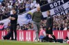 Manchester United's head coach Erik ten Hag, centre, and Tottenham's head coach Ange Postecoglou, left, react during the Premier League soccer match between Tottenham Hotspur and Manchester United at the Tottenham Hotspur Stadium in London, England, Saturday, Aug. 19, 2023. (AP Photo/Alberto Pezzali)