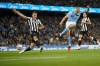 Newcastle's Sven Botman, left, tries to block a shot from Manchester City's Erling Haaland during the English Premier League soccer match between Manchester City and Newcastle at the Etihad stadium in Manchester, England, Saturday, Aug. 19, 2023. (AP Photo/Dave Thompson)