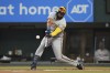 Milwaukee Brewers' Carlos Santana hits a solo home run during the first inning of a baseball game against the Texas Rangers in Arlington, Texas, Saturday, Aug. 19, 2023. (AP Photo/LM Otero)