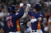 Houston Astros' Alex Bregman, right, celebrates with Yordan Alvarez after hitting a solo home run during the third inning of a baseball game against the Seattle Mariners, Saturday, Aug. 19, 2023, in Houston. (AP Photo/Kevin M. Cox)