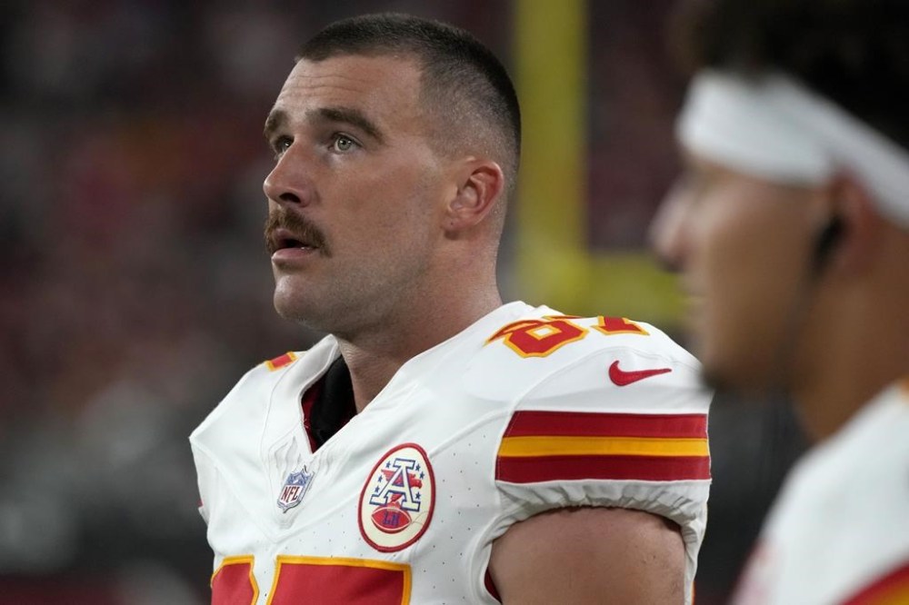 Kansas City Chiefs tight end Travis Kelce watches from the sidelines during the first half of an NFL preseason football game against the Arizona Cardinals, Saturday, Aug. 19, 2023, in Glendale, Ariz. (AP Photo/Rick Scuteri)