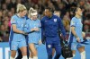 England's Alex Greenwood, centre left, leaves the pitch injured during the final of Women's World Cup soccer between Spain and England at Stadium Australia in Sydney, Australia, Sunday, Aug. 20, 2023. (AP Photo/Rick Rycroft)