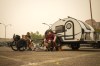 Veteran Rob Pullen, left, and Warren Pullen, who were evacuated from their home on Thursday due to wildfires, sit with their dogs outside their trailer in the parking lot at an evacuation centre, in Kelowna, B.C., on Saturday, Aug. 19, 2023. THE CANADIAN PRESS/Darryl Dyck