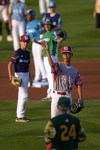 Japan's Hinata Uchigaki (14) helps toss in the ceremonial first pitch with help from fellow Little Leaguers before the Little League Classic baseball game between the Philadelphia Phillies and the Washington Nationals at Bowman Stadium in Williamsport, Pa., Sunday, Aug. 20, 2023. (AP Photo/Gene J. Puskar)