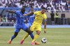 Al-Nassr's Cristiano Ronaldo, right, fights for the ball against Al-Hilal's Kalidou Koulibaly during the Arab Club Champions Cup between Al-Nassr and Al-Hilal at King Fahd Stadium in Taif, Saudi Arabia, Saturday, Aug. 12, 2023. (AP Photo/Samah Zidan)