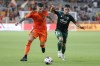 Houston Dynamo defender Franco Escobar, left, and Portland Timbers forward Felipe Mora, right, chase the ball during the second half of an MLS soccer match Sunday, Aug. 20, 2023, in Houston. (AP Photo/Michael Wyke)
