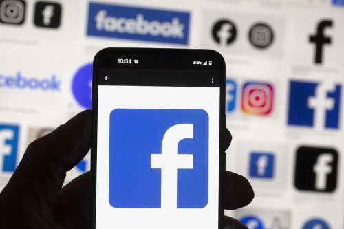 The Friends of Canadian Broadcasting group is asking people to stop posting content on Meta's platforms on Aug. 23 and 24. The Facebook logo is seen on a mobile phone, Oct. 14, 2022, in Boston. THE CANADIAN PRESS/AP-Michael Dwyer