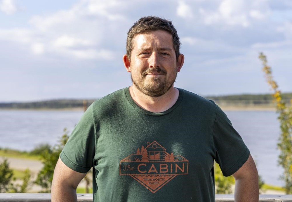 Ollie Williams, a former BBC sports journalist and the editor and co-founder at Cabin Radio, an independent community news outlet in Yellowknife is shown in Fort Simpson, N.W.T. on Sunday Aug. 20, 2023. THE CANADIAN PRESS/HO-Cabin Radio-Emily Blake
**MANDATORY CREDIT **