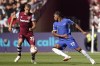 Chelsea's Carney Chukwuemeka, right, challenges for the ball with West Ham's Tomas Soucek during the English Premier League soccer match between West Ham and Chelsea, at the London Stadium in London, Sunday, Aug. 20, 2023. (AP Photo/Alberto Pezzali)