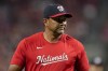 Washington Nationals manager Dave Martinez walks to the dugout after making a pitching change during the ninth inning of a baseball game against the Cincinnati Reds, Friday, Aug. 4, 2023, in Cincinnati. (AP Photo/Jeff Dean)