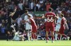 Liverpool's Alexis Mac Allister, center, receives a red card during the Premier League soccer match between Liverpool and AFC Bournemouth at Anfield, in Liverpool, England, Saturday, Aug. 19, 2023. (AP Photo/Rui Vieira)