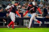 Washington Nationals shortstop CJ Abrams (5) celebrates with third base coach Gary Disarcina (10) as he runs the bases on a home run against the New York Yankees during the eighth inning of a baseball game Tuesday, Aug. 22, 2023, in New York. (AP Photo/Frank Franklin II)