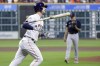 Houston Astros' Kyle Tucker, left, flips his bat as he rounds the bases on his two run home run as Boston Red Sox starting pitcher Tanner Houck, right, looks on during the first inning of a baseball game Tuesday, Aug. 22, 2023, in Houston. (AP Photo/Michael Wyke)