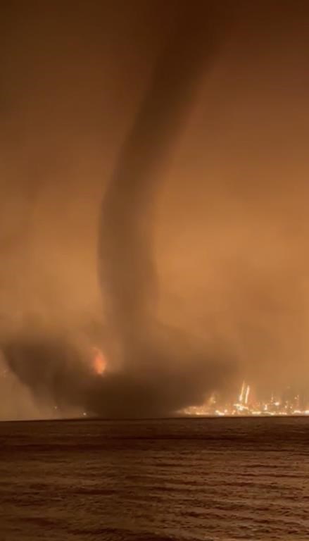 A fire tornado, or fire whirl, is seen in a video shot by the BC Wildfire Service at Gun Lake in the B.C. Interior overnight on August 17, 2023. THE CANADIAN PRESS/HO - BC Wildfire Service