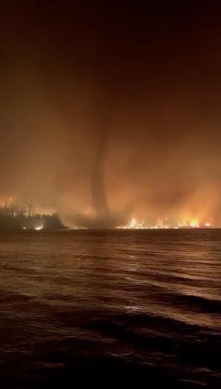 A fire tornado, or fire whirl, is seen in a video shot by the BC Wildfire Service at Gun Lake in the B.C. Interior overnight on August 17, 2023. THE CANADIAN PRESS/HO - BC Wildfire Service