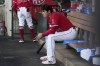 Los Angeles Angels' Shohei Ohtani sits in the dugout during the first inning of a baseball game against the Cincinnati Reds Tuesday, Aug. 22, 2023, in Anaheim, Calif. (AP Photo/Mark J. Terrill)