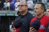 Cleveland Guardians manager Terry Francona, left, stands for the national anthem next to third base coach Mike Sarbaugh, right, before the team's baseball game against the Los Angeles Dodgers, Tuesday, Aug. 22, 2023, in Cleveland. (AP Photo/Sue Ogrocki)