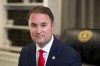 FILE - Virginia Attorney General Jason Miyares sits for a portrait in his office, May 9, 2023, in Richmond, Va. In a nonbinding legal analysis released Thursday, Aug. 24, Miyares said that Republican Gov. Glenn Youngkin's new model policies for the treatment of transgender students are in line with federal and state nondiscrimination laws and school boards must follow their guidance. (AP Photo/Ryan M. Kelly, File)
