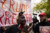 A protester on the left, chants against a supporter of former President Donald Trump, right, near the Fulton County Jail, Thursday, Aug. 24, 2023, in Atlanta. (AP Photo/Brynn Anderson)
