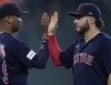 Boston Red Sox third baseman Rafael Devers, left, and center fielder Wilyer Abreu, right, high-five after a baseball game against the Houston Astros, Thursday, Aug. 24, 2023, in Houston. (AP Photo/Kevin M. Cox)