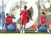 Canada forward Alphonso Davies, left, defender Sam Adekugbe, centre, and forward Tajon Buchanan joke around during practice at the World Cup in Doha, Qatar on Monday, November 28, 2022. THE CANADIAN PRESS/Nathan Denette