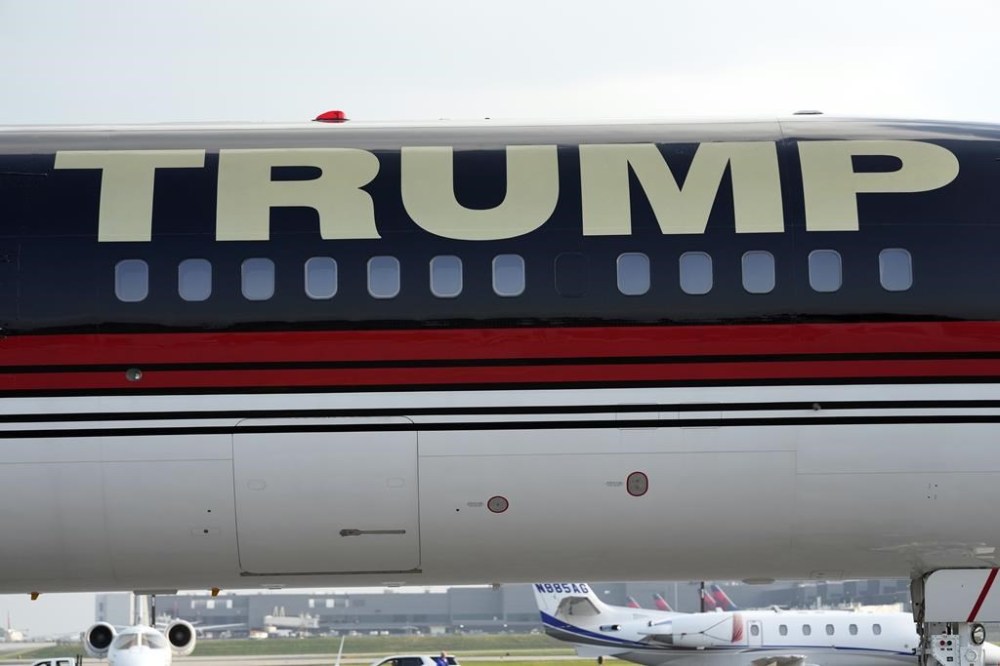 The plane carrying former President Donald Trump taxis at Hartsfield-Jackson Atlanta International Airport, Thursday, Aug. 24, 2023, in Atlanta. (AP Photo/Alex Brandon)