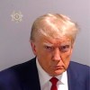 This booking photo provided by Fulton County Sheriff's Office, shows former President Donald Trump on Thursday, Aug. 24, 2023, after he surrendered and was booked at the Fulton County Jail in Atlanta. Trump is accused by District Attorney Fani Willis of scheming to subvert the will of Georgia voters in a desperate bid to keep Joe Biden out of the White House. (Fulton County Sheriff's Office via AP)