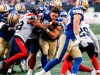 Montreal Alouettes' Tyrell Richards (42) hits Winnipeg Blue Bombers' Brady Oliveira (20) as he runs with no helmet during first half CFL action in Winnipeg Thursday, August 24, 2023.  THE CANADIAN PRESS/John Woods