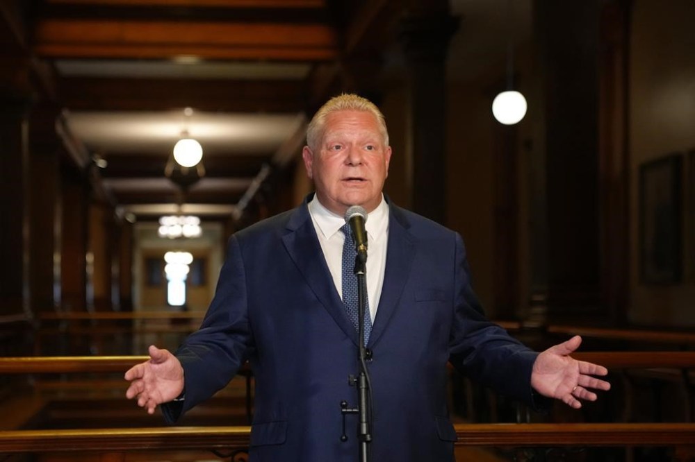 Ontario Premier Doug Ford speaks to journalists at the Queen's Park Legislature in Toronto on Friday August 25, 2023. Ford says he's confident that nothing criminal took place in his government's process of removing protected Greenbelt lands for housing development.THE CANADIAN PRESS/Chris Young