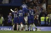 Chelsea players celebrate after teammate Raheem Sterling scored his side's second goal during the English Premier League soccer match between Chelsea and Luton Town at Stamford Bridge stadium in London, Saturday, Aug. 26, 2023. (AP Photo/Ian Walton)