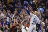 Los Angeles Dodgers' Mookie Betts tips his helmet as he comes up to bat against the Boston Red Sox during the first inning of a baseball game Friday, Aug. 25, 2023, in Boston. (AP Photo/Michael Dwyer)