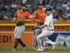 Detroit Tigers' Parker Meadows, right, rounds third base past Houston Astros second baseman Jose Altuve, left, and shortstop Jeremy Pena, center, during the fifth inning of a baseball game Friday, Aug. 25, 2023, in Detroit. (AP Photo/Duane Burleson)