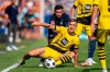 Bochum's Kevin Stoger background centre and Dortmund's Nico Schlotterbeck vie for the ball, during the German Bundesliga soccer match between VfL Bochum and Borussia Dortmund, at the Vonovia Ruhrstadion, in Bochum, Germany, Saturday, Aug. 26, 2023. (David Inderlied/dpa via AP)